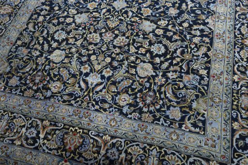 Close-up detail of 2000s Kashan rug from Iran / Persia showing Wool weave