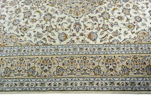 Corner detail of 2000s Kashan rug showing border pattern and Wool pile