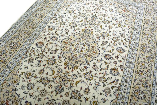 Backside of handmade 2000s Kashan rug showing knot structure and weave density