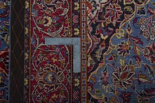 Surface texture of 2000s Kashan rug with natural Wool and intricate pattern