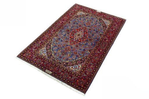 Corner detail of 2000s Kashan rug showing border pattern and Wool pile