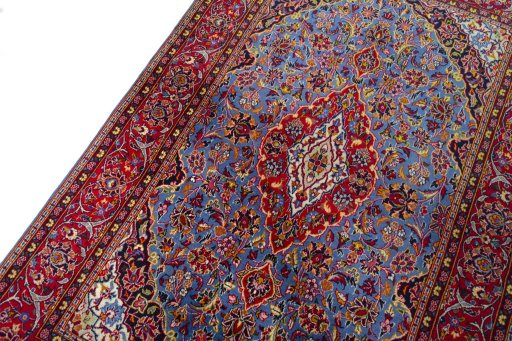 Backside of handmade 2000s Kashan rug showing knot structure and weave density