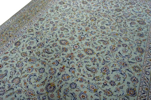 Backside of handmade 2000s Kashan rug showing knot structure and weave density