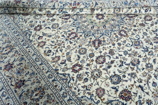 Close-up detail of 2000s Kashan rug from Iran / Persia showing Wool weave