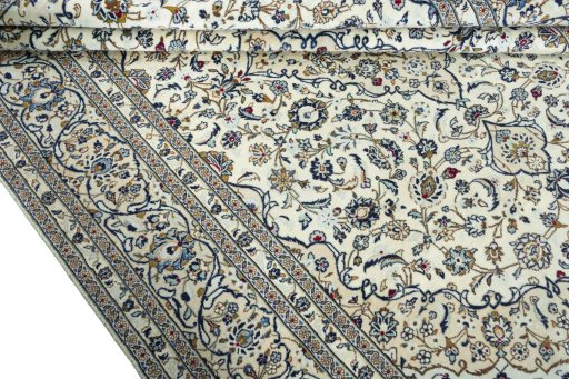 Close-up detail of 2000s Kashan rug from Iran / Persia showing Wool weave