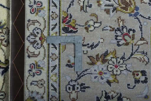 Backside of handmade 2000s Kashan rug showing knot structure and weave density