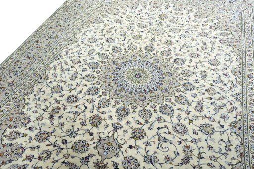 Backside of handmade 2000s Kashan rug showing knot structure and weave density
