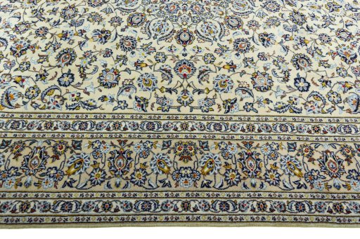 Corner detail of 2000s Kashan rug showing border pattern and Wool pile