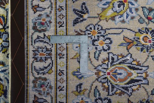 Backside of handmade 2000s Kashan rug showing knot structure and weave density