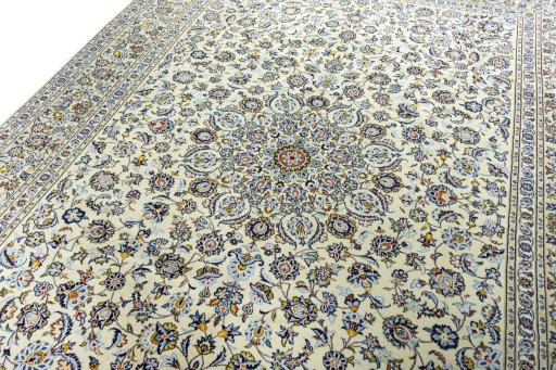 Backside of handmade 2000s Kashan rug showing knot structure and weave density