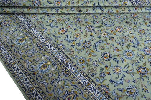 Close-up detail of 2000s Kashan rug from Iran / Persia showing Wool weave