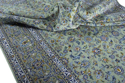 Surface texture of 2000s Kashan rug with natural Wool and intricate pattern