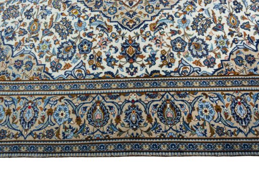 Corner detail of 2000s Kashan rug showing border pattern and Wool pile
