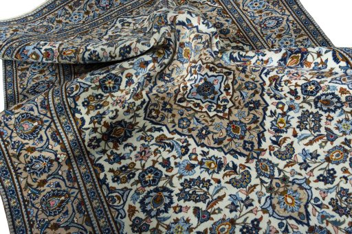Surface texture of 2000s Kashan rug with natural Wool and intricate pattern