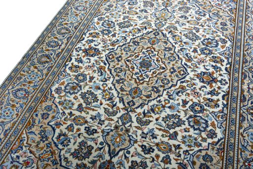 Backside of handmade 2000s Kashan rug showing knot structure and weave density