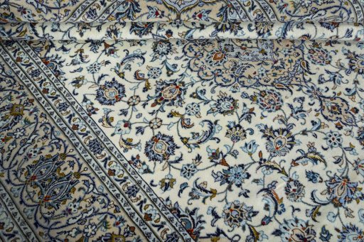 Close-up detail of 2000s Kashan rug from Iran / Persia showing Wool weave
