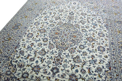 Backside of handmade 2000s Kashan rug showing knot structure and weave density