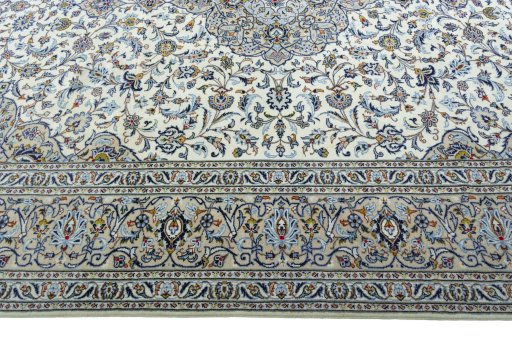 Corner detail of 2000s Kashan rug showing border pattern and Wool pile