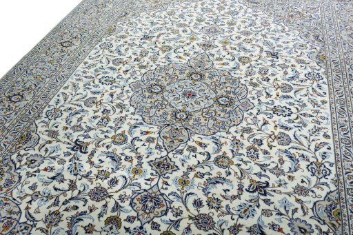 Backside of handmade 2000s Kashan rug showing knot structure and weave density