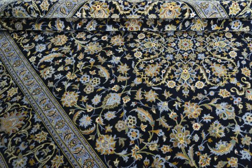 Close-up detail of 2000s Kashan rug from Iran / Persia showing Wool weave