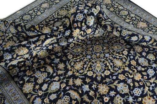 Surface texture of 2000s Kashan rug with natural Wool and intricate pattern