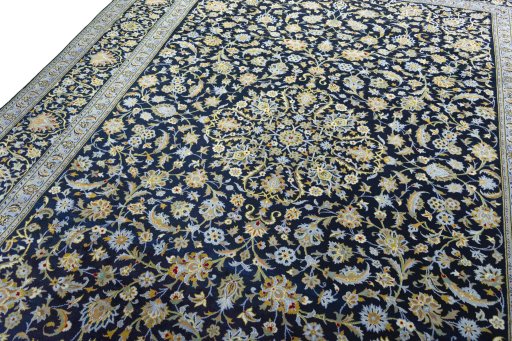 Backside of handmade 2000s Kashan rug showing knot structure and weave density