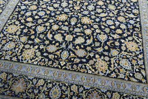 Close-up detail of 2000s Kashan rug from Iran / Persia showing Wool weave