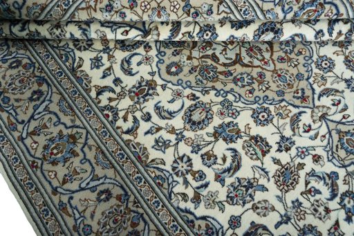 Close-up detail of 2000s Kashan rug from Iran / Persia showing Wool weave