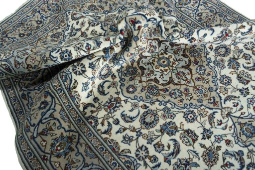 Surface texture of 2000s Kashan rug with natural Wool and intricate pattern