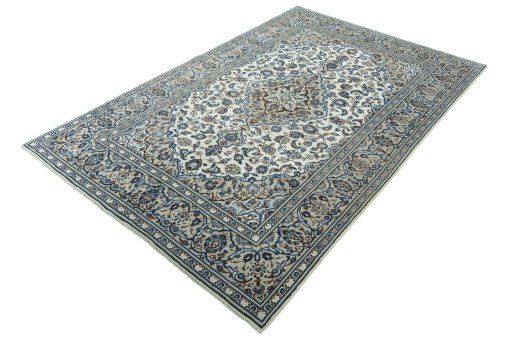 Corner detail of 2000s Kashan rug showing border pattern and Wool pile