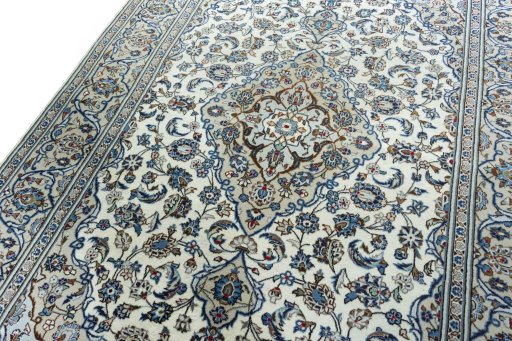 Backside of handmade 2000s Kashan rug showing knot structure and weave density
