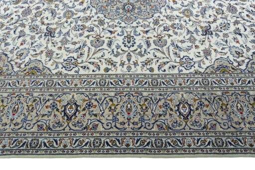 Corner detail of 2000s Kashan rug showing border pattern and Wool pile