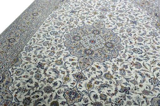 Backside of handmade 2000s Kashan rug showing knot structure and weave density