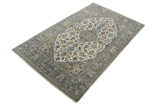 Corner detail of 2000s Kashan rug showing border pattern and Wool pile
