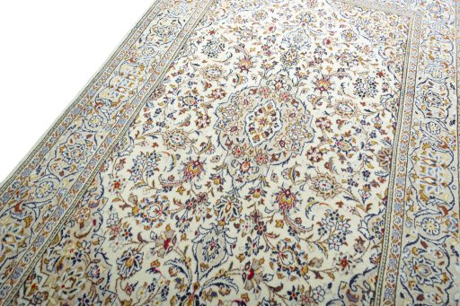 Backside of handmade 2000s Kashan rug showing knot structure and weave density