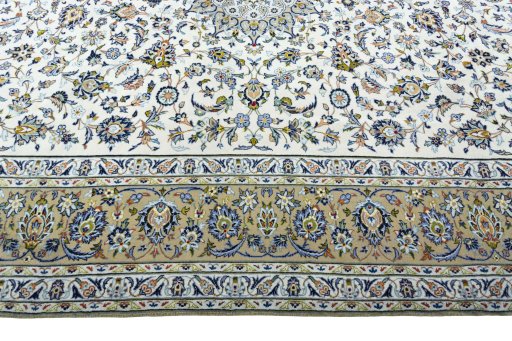 Corner detail of 2000s Kashan rug showing border pattern and Wool pile