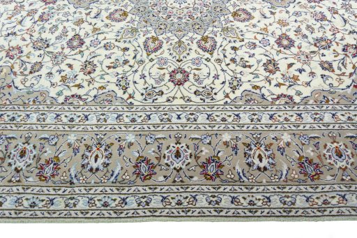 Corner detail of 2000s Kashan rug showing border pattern and Wool pile