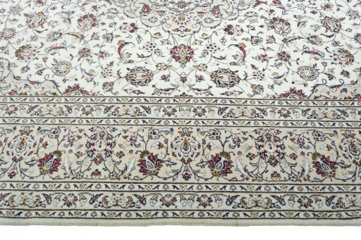 Corner detail of 2000s Kashan rug showing border pattern and Wool pile