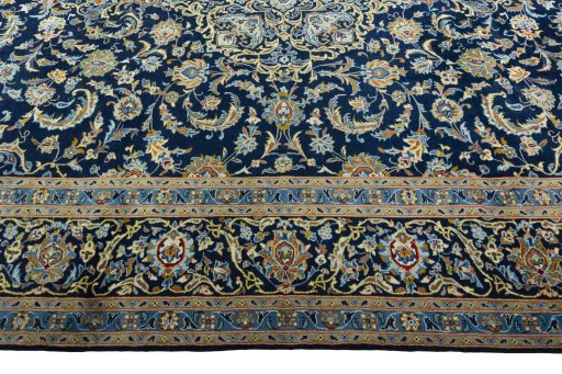 Corner detail of 2000s Kashan rug showing border pattern and Wool pile