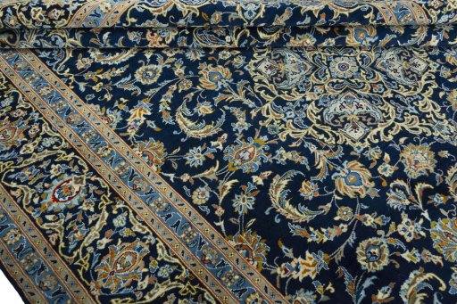 Close-up detail of 2000s Kashan rug from Iran / Persia showing Wool weave