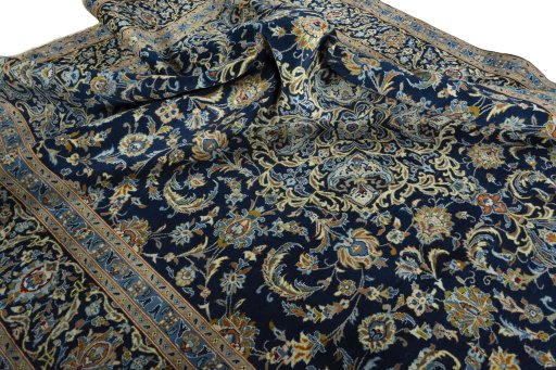 Surface texture of 2000s Kashan rug with natural Wool and intricate pattern