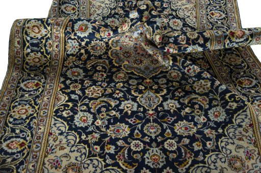 Surface texture of 1970s Kashan rug with natural Wool and intricate pattern