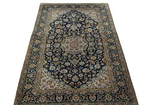 Surface texture of 1970s Kashan rug with natural Wool and intricate pattern