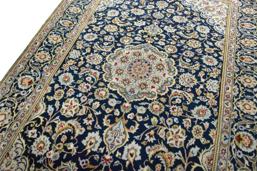 Backside of handmade 1970s Kashan rug showing knot structure and weave density