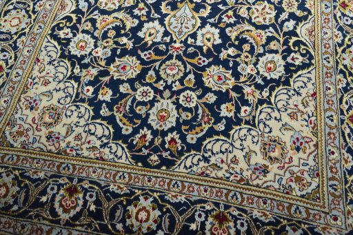 Close-up detail of 1970s Kashan rug from Iran / Persia showing Wool weave