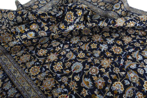 Surface texture of 2000s Kashan rug with natural Wool and intricate pattern