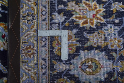 Backside of handmade 2000s Kashan rug showing knot structure and weave density