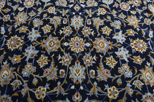 Central medallion detail of 2000s Kashan rug from Iran / Persia