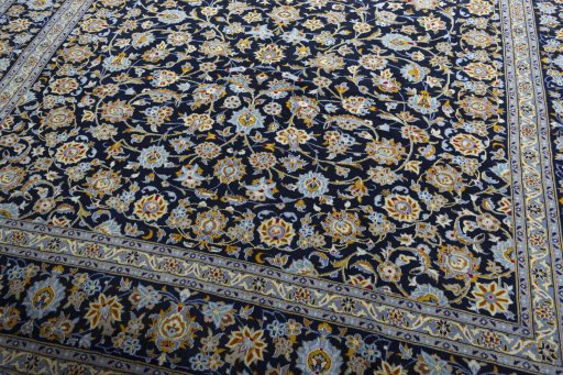 Close-up detail of 2000s Kashan rug from Iran / Persia showing Wool weave