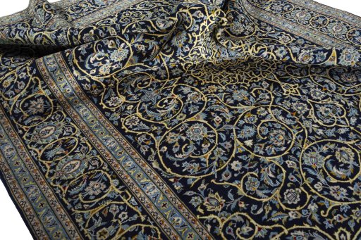 Surface texture of 2000s Kashan rug with natural Wool and intricate pattern